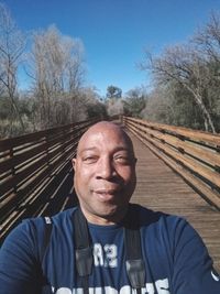 Portrait of man against blue sky