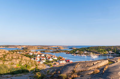 Scenic view of sea and buildings against sky