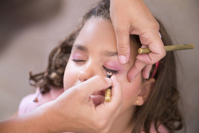 Close-up of young woman with hands