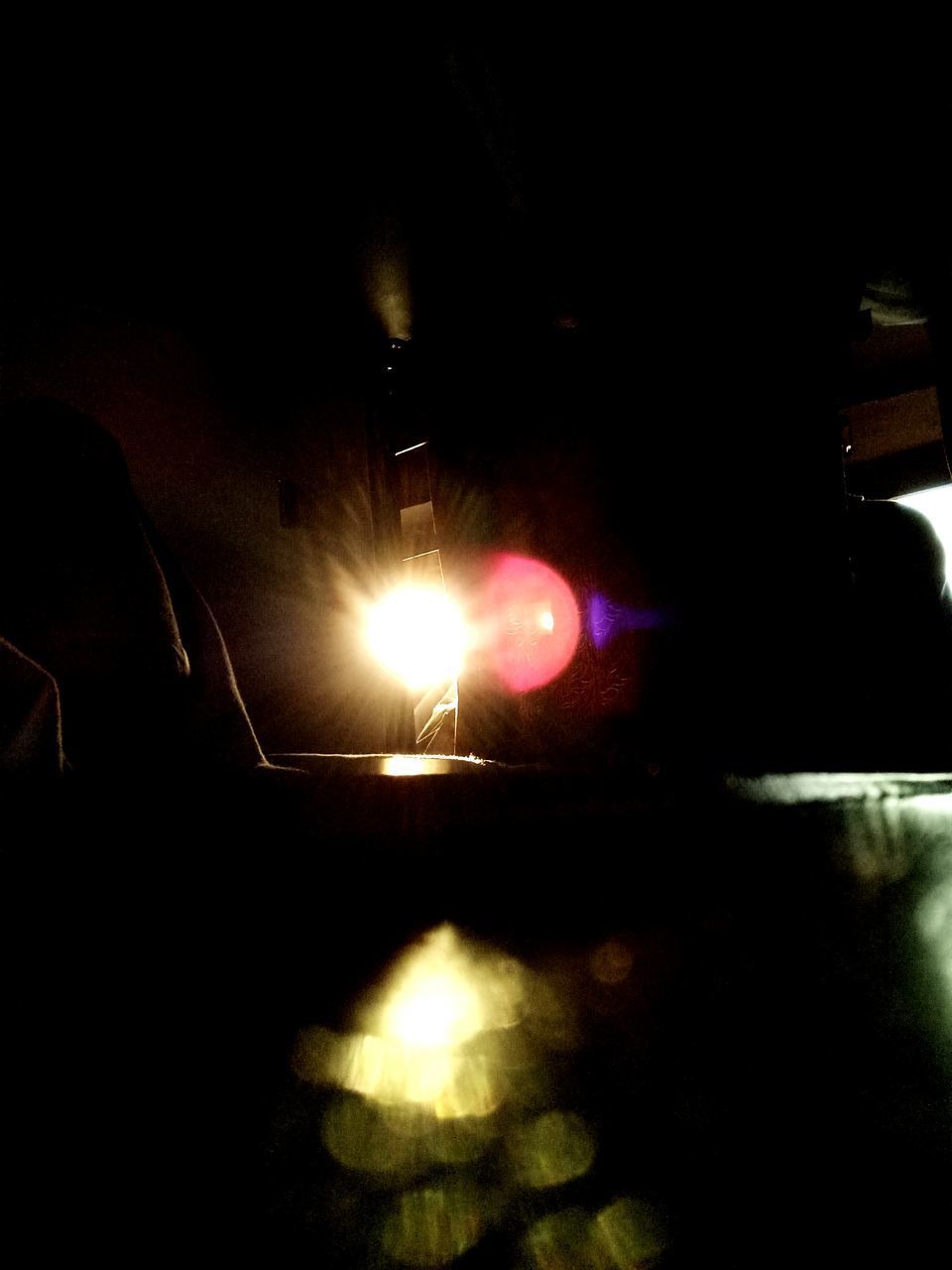 CLOSE-UP OF ILLUMINATED CAR WINDSHIELD