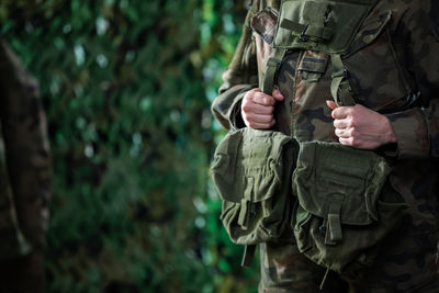 Sample uniforms and equipment of a soldier in the polish army. woman in polish army.