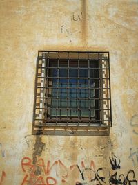 Low angle view of window on old building