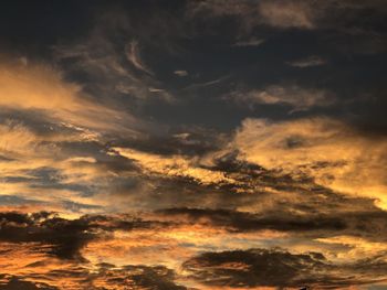 Low angle view of dramatic sky during sunset