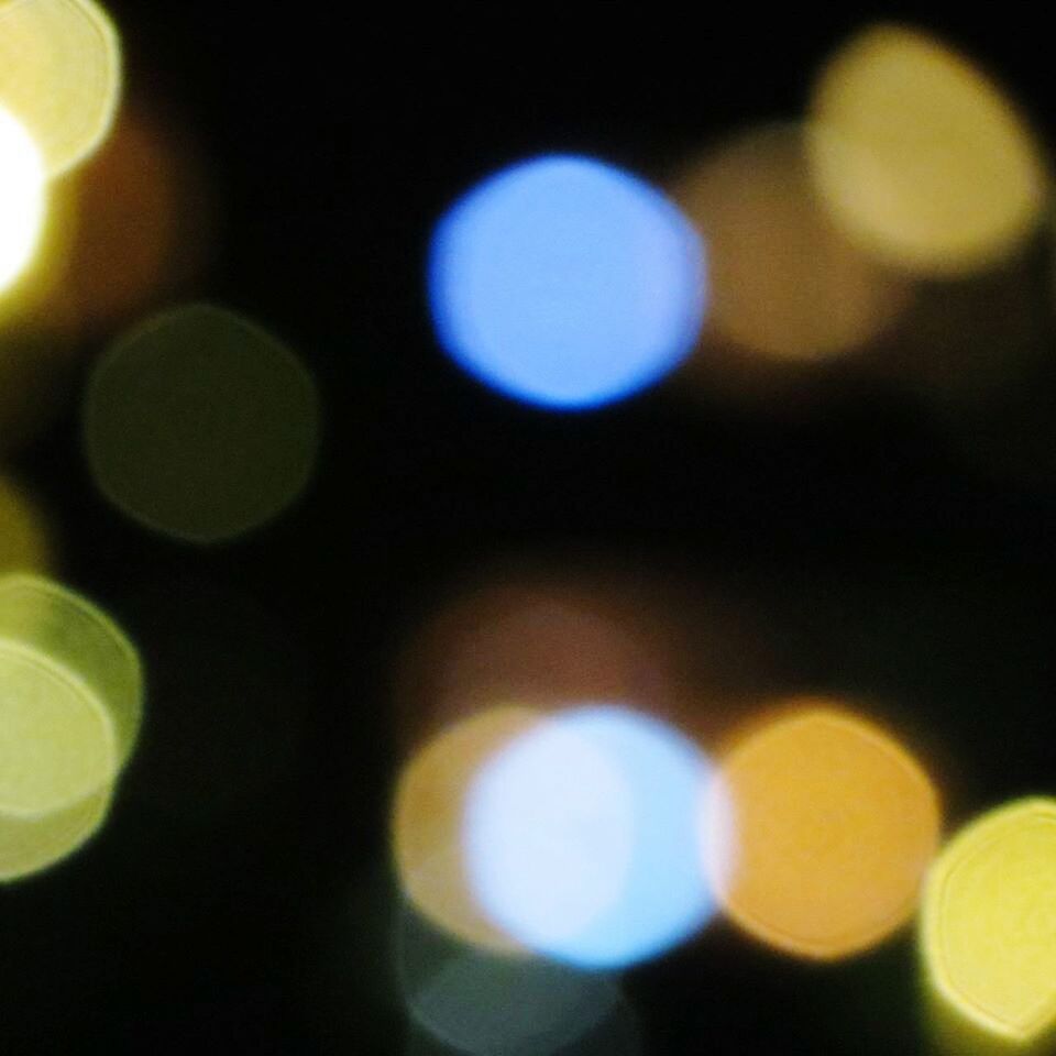 illuminated, night, defocused, lighting equipment, glowing, light - natural phenomenon, circle, indoors, lens flare, abstract, close-up, light, full frame, pattern, backgrounds, multi colored, selective focus, no people, yellow, focus on foreground