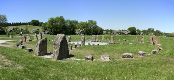 Panoramic view of cemetery on field against sky