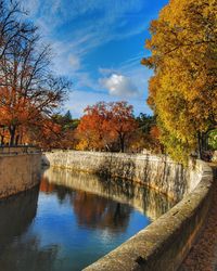 Scenic view of lake against sky during autumn