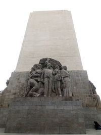 Low angle view of statue against sky