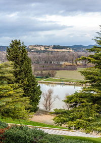 Scenic view of green landscape against sky