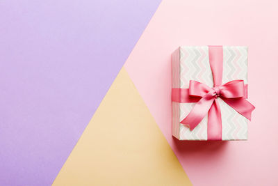 High angle view of gift box against blue background