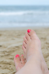 Low section of woman on beach