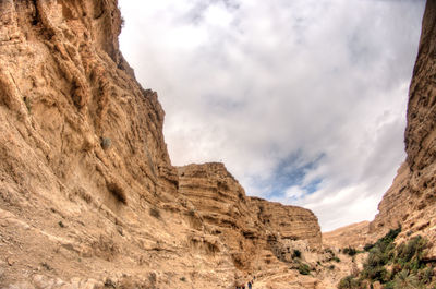 Low angle view of rock formations against sky