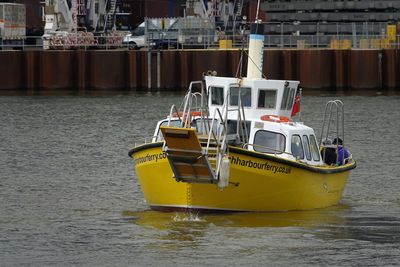 Boats moored at harbor