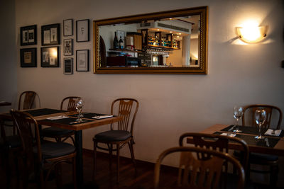 Empty chairs and tables in restaurant