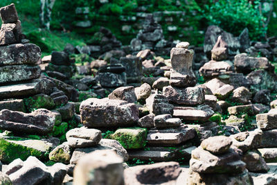 Stack of stones on rocks in forest