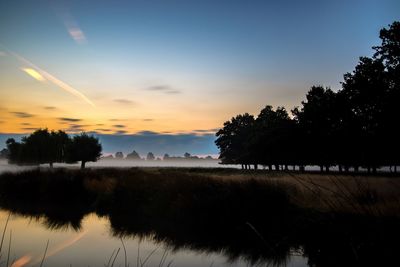 Scenic view of landscape at sunset