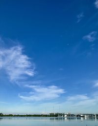 Scenic view of sea against blue sky