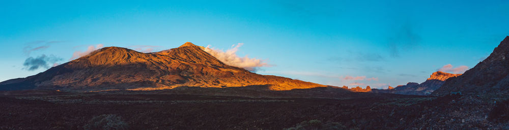 Panoramic view of mountain range against sky