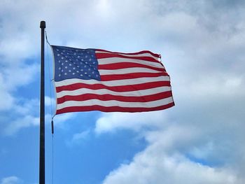 Low angle view of flag against sky