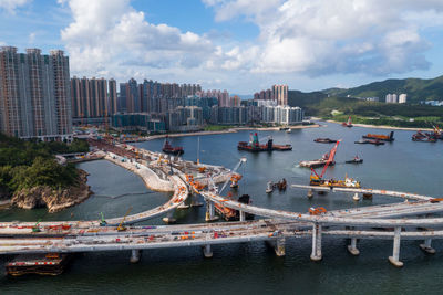 Panoramic view of bay bridge and city against sky