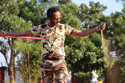 Portrait of young woman holding umbrella