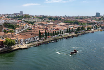 High angle view of river amidst buildings in city