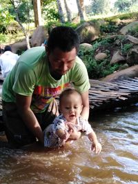 Father and son on water
