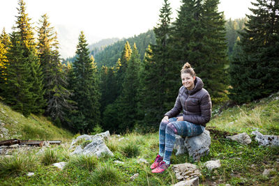 Man sitting in forest
