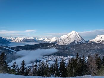 Scenic view of snowcapped mountains against sky