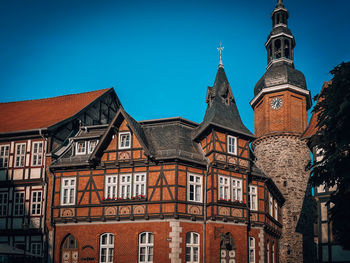 Low angle view of building against clear blue sky