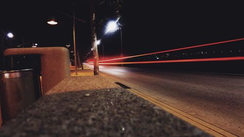 Light trails on road in city at night