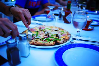 Midsection of food served on table in restaurant