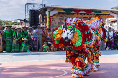 Multi colored umbrellas on street in city