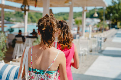 Rear view of woman standing outdoors