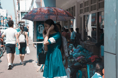 People walking on street in city