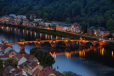 High angle view of bridge over river by buildings in city