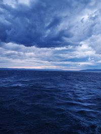 Scenic view of sea against blue sky
