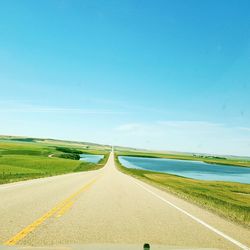 Empty road against clear sky