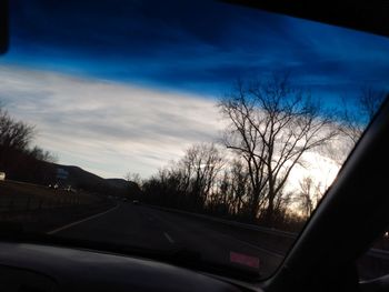 View of road seen through car windshield