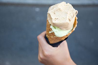 Close-up of hand holding ice cream