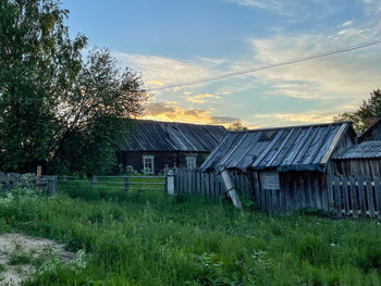 House on field against sky