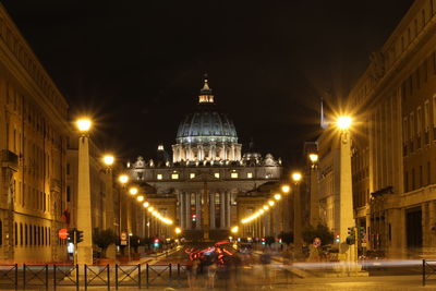 Illuminated st peter basilica against sky at night