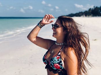 Young woman wearing sunglasses on beach