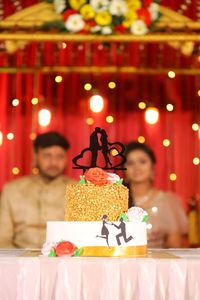 Woman and cake on table