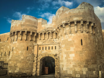 View of historical building against cloudy sky