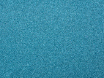 Full frame shot of blue glittering paper