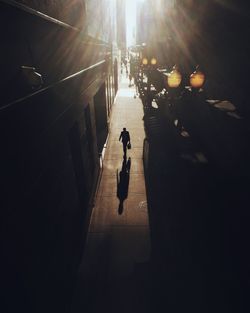 High angle view of man walking on road in city