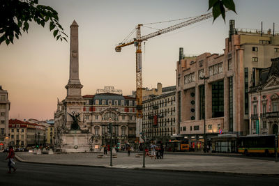 Buildings in city against sky