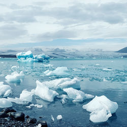 Scenic view of frozen sea against sky