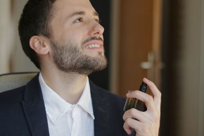 Portrait of young man using mobile phone