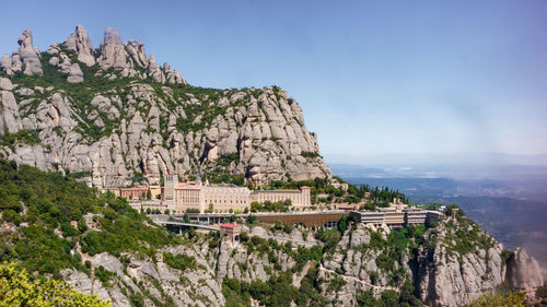 Scenic view of monastery against mountain and sky